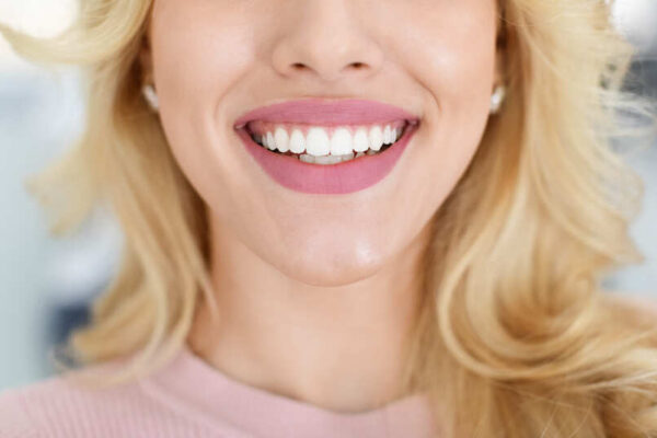 blonde-lady-showing-beautiful-white-teeth-cropped-2022-10-07-02-26-47-utc (1)