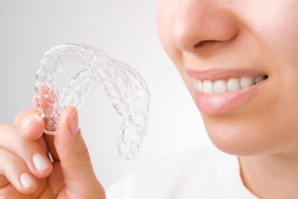 cheerful-young-woman-holding-plastic-transparent-b-2022-01-28-10-45-53-utc (2)