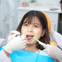 dentists-working-with-young-ethnic-girl-in-chair-2021-08-26-19-52-38-utc (1)